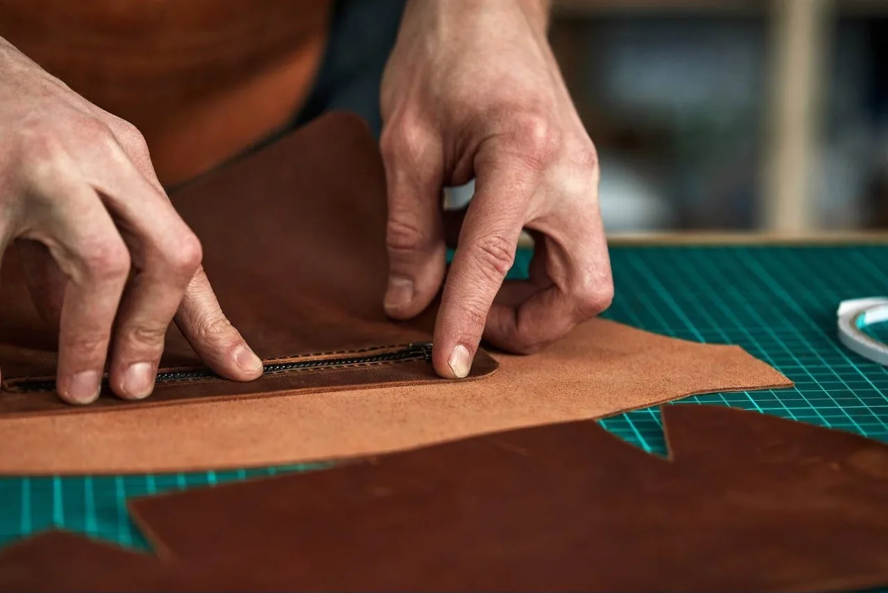 tailor s hands purchase plan partner tries detail leather product steam room collects bag parts business 220429272